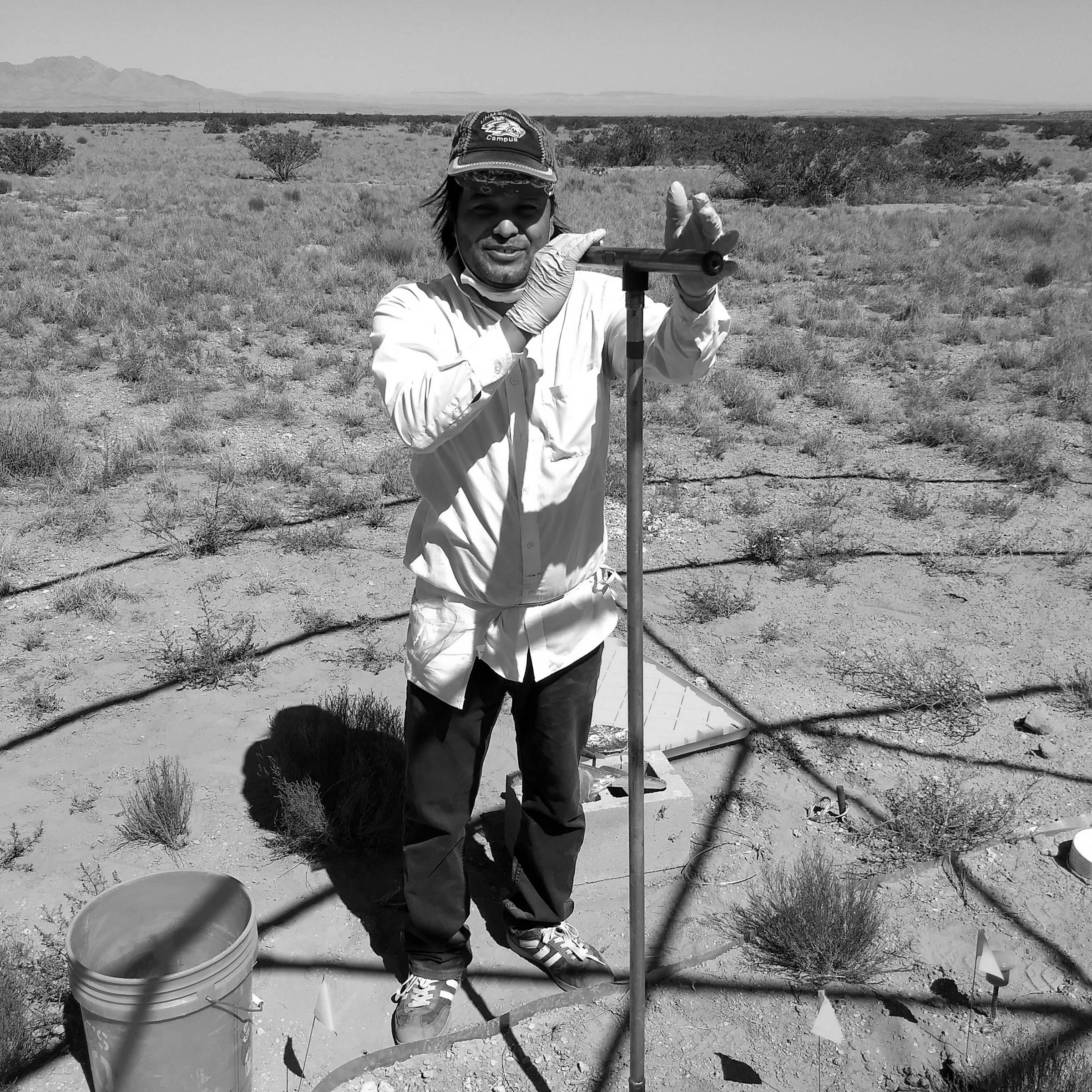Rudgers lab manager Purbendra Yogi takes a soil sample with an auger.