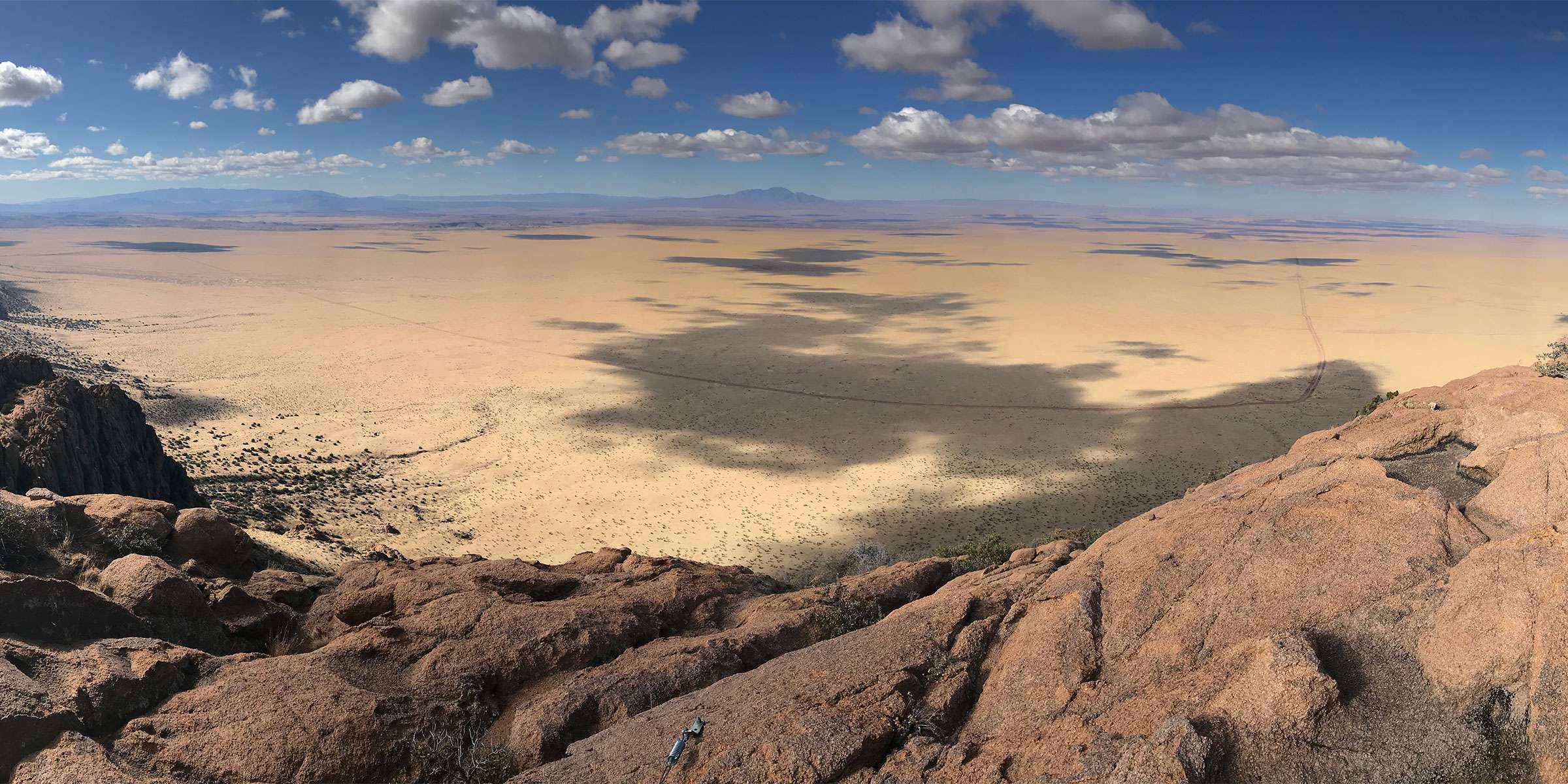 A panoramic of the Sevilleta Wildlife Refuge shows a transition from mountain foothills to desert grassland.